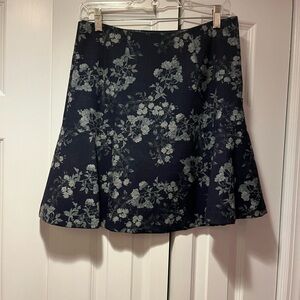 Mini navy skirt. Absolutely adorable fit. Has a little flair.